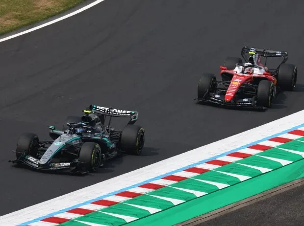 Andrea Kimi Antonelli (Mercedes W17) and Lewis Hamilton (Ferrari SF-26) at the 2026 Formula 1 race in Japan