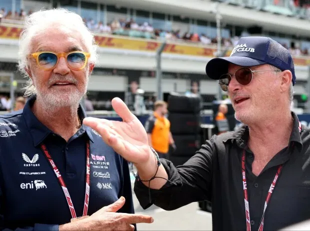Flavio Briatore and Eddie Irvine on the Formula 1 starting grid