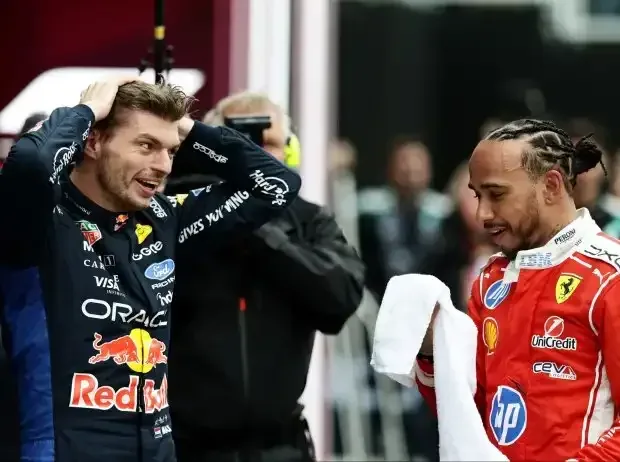 Title image for the news: Lewis Hamilton and Max Verstappen in a casual conversation: Both wear a smile on their faces