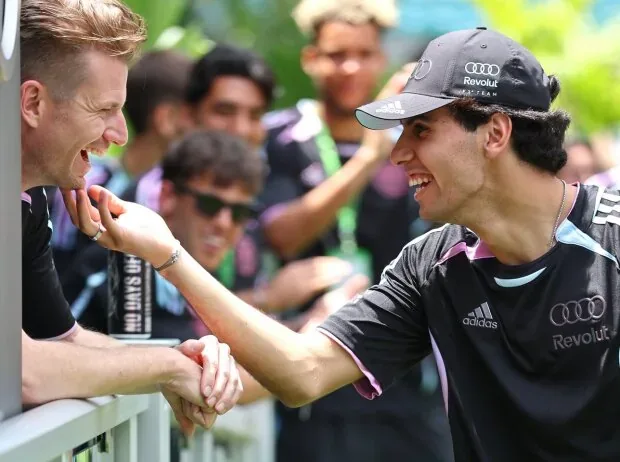 Nico Hülkenberg and Gabriel Bortoleto (both Audi) joking