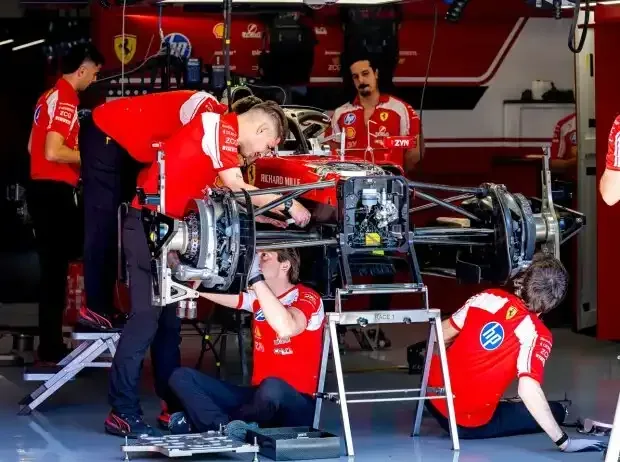 Title image for the news: Ferrari mechanics working on the car in the garage