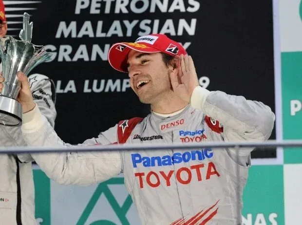 Timo Glock celebrates his podium finish in 2009 in Malaysia