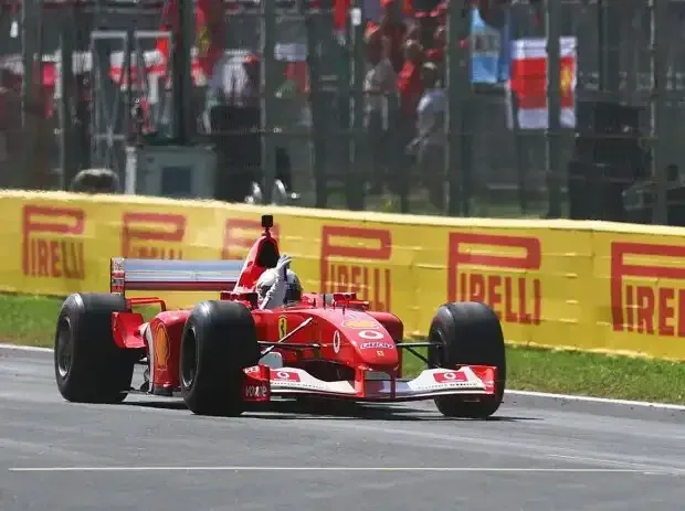 Title image for the news: Sebastian Vettel during his demo laps in the Ferrari F2002 of Michael Schumacher in Monza 2026