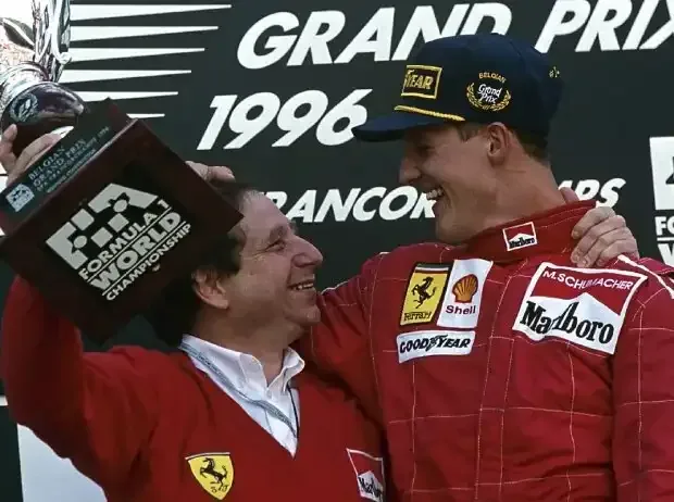 Title image for the news: Jean Todt and Michael Schumacher celebrate on the Formula 1 podium