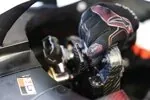 Esteban Ocon (Haas) with one hand on the steering wheel in the Haas VF-26