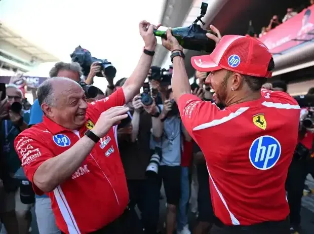 Title image for the news: Lewis Hamilton and Ferrari team principal Frederic Vasseur celebrate the 2026 victory in Barcelona